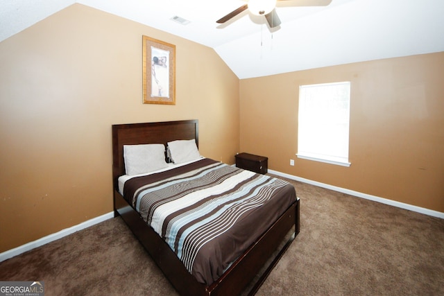 carpeted bedroom featuring ceiling fan and vaulted ceiling