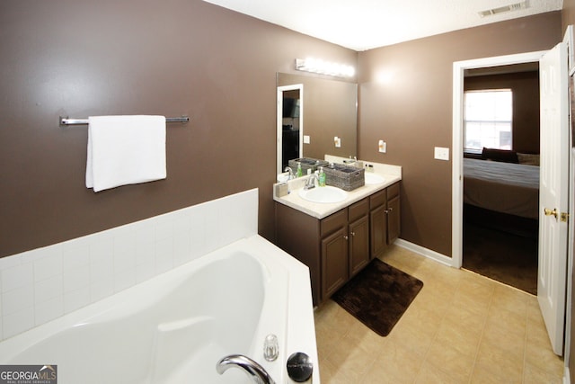 bathroom with vanity and a bathtub