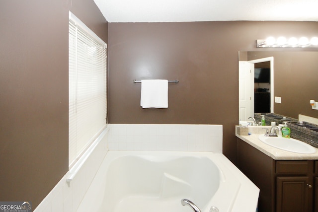 bathroom featuring a bath and vanity