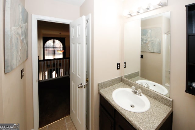 bathroom with tile patterned floors and vanity