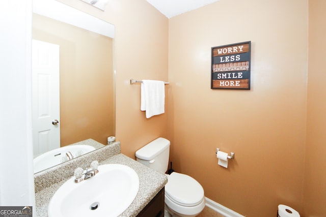 bathroom with vanity and toilet