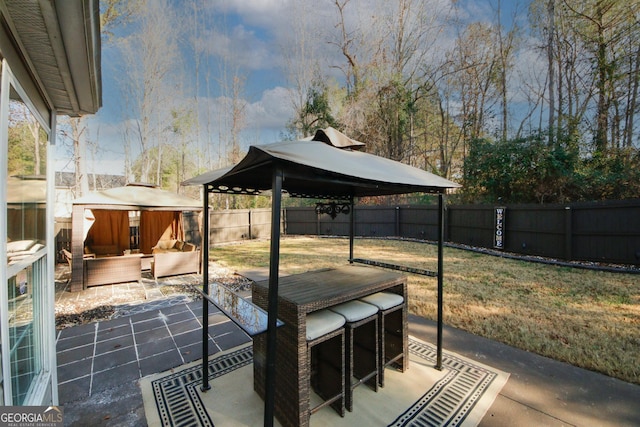 view of patio with a storage shed