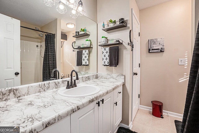 bathroom featuring curtained shower, tile patterned flooring, and vanity