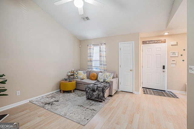 interior space featuring ceiling fan, light hardwood / wood-style floors, and lofted ceiling