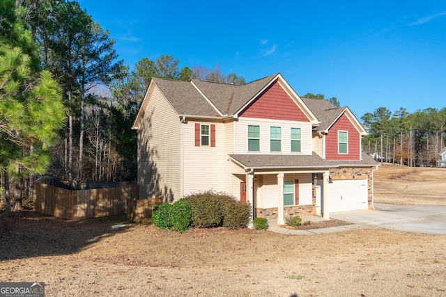 view of front of home featuring a porch and a garage