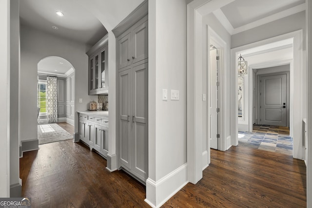 corridor with dark hardwood / wood-style flooring