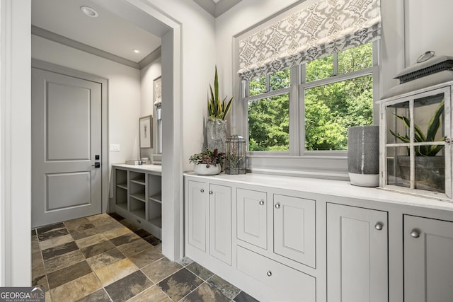 bathroom with vanity and crown molding