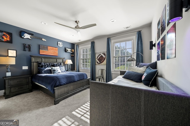 bedroom with ceiling fan and carpet floors