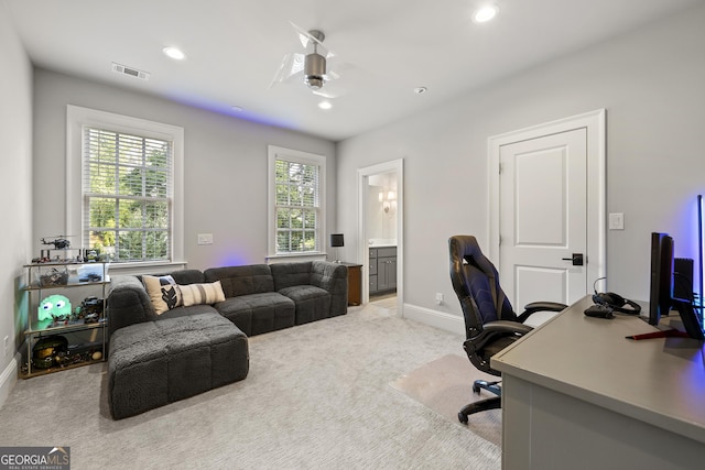 office area with light carpet and ceiling fan