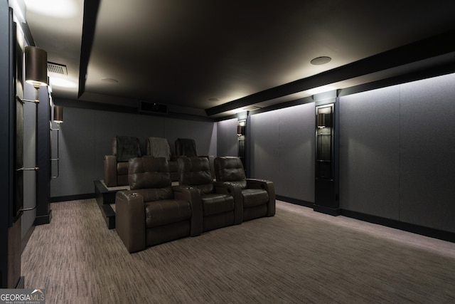 home theater room with dark carpet