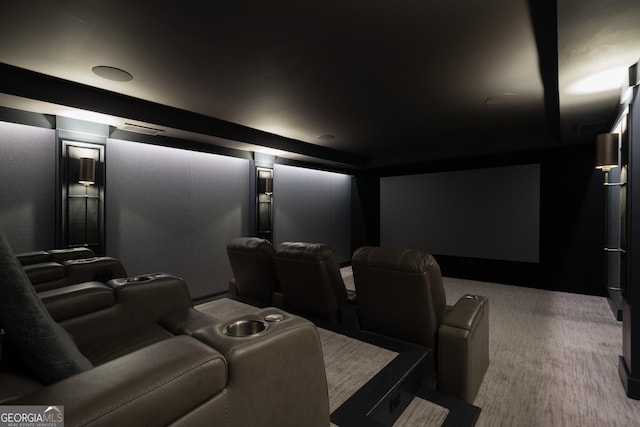 cinema room featuring carpet flooring