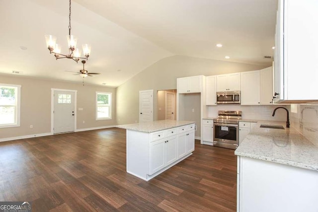 kitchen featuring white cabinetry, sink, a healthy amount of sunlight, and appliances with stainless steel finishes