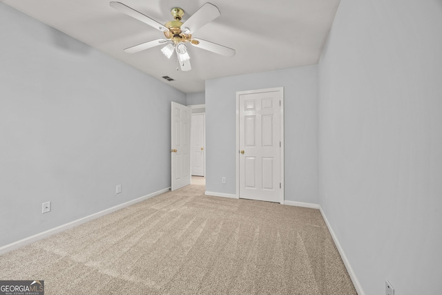 unfurnished bedroom featuring visible vents, ceiling fan, carpet floors, and baseboards