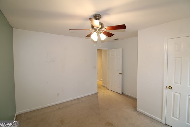 unfurnished bedroom with baseboards, visible vents, and ceiling fan