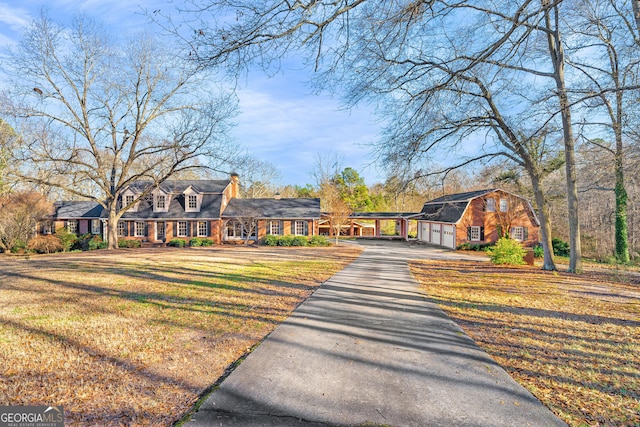 view of front of house with a front lawn and a carport