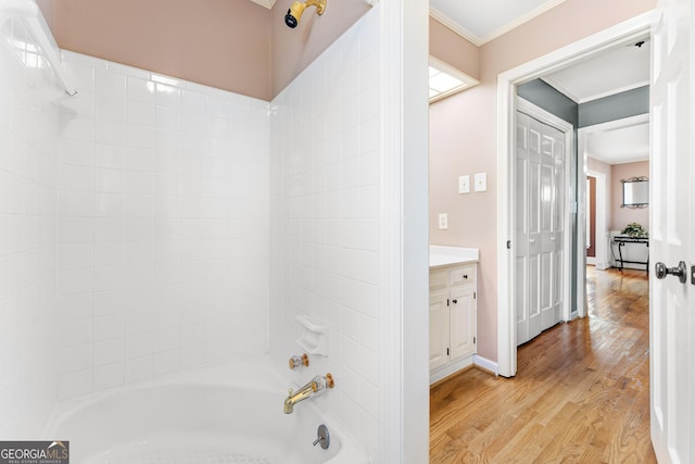 bathroom with shower / bath combination, vanity, and wood-type flooring