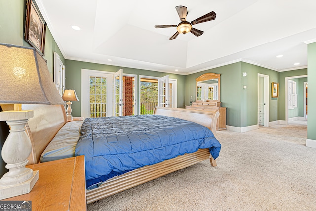 bedroom featuring a raised ceiling, crown molding, ceiling fan, access to exterior, and carpet floors