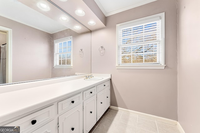 bathroom featuring tile patterned flooring, vanity, and ornamental molding