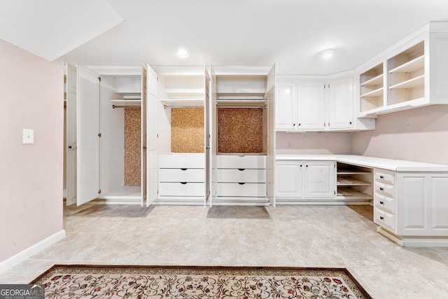 kitchen featuring white cabinets