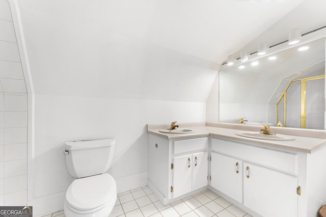 bathroom with vanity, tile patterned floors, vaulted ceiling, toilet, and an enclosed shower