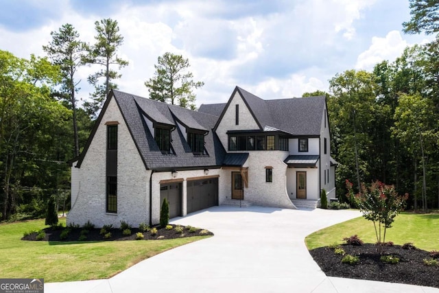 view of front facade featuring a garage and a front lawn