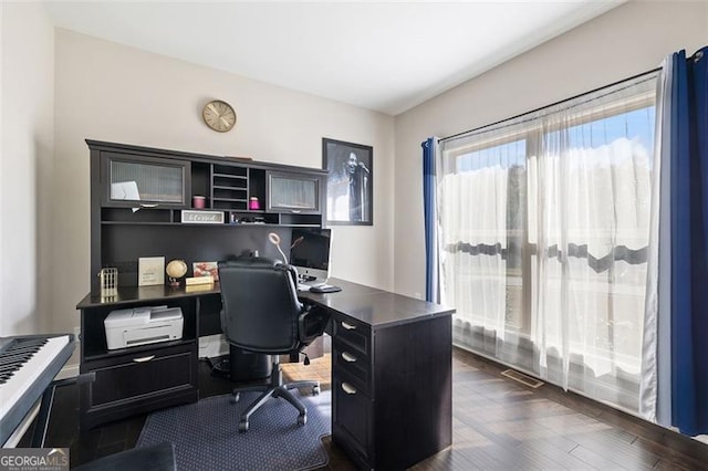 office with dark wood-type flooring