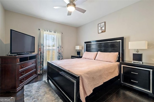 bedroom featuring ceiling fan and dark hardwood / wood-style flooring