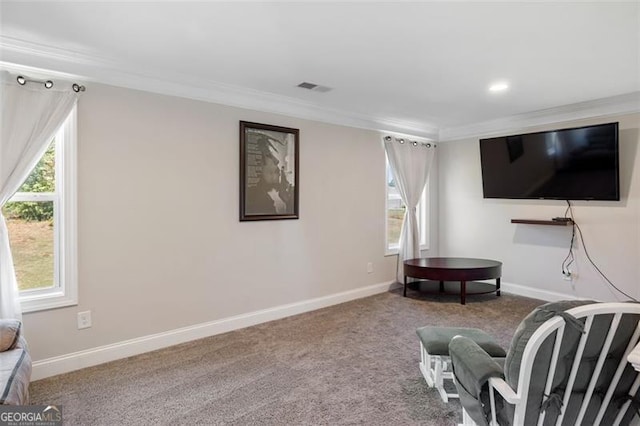 living area with carpet flooring and crown molding