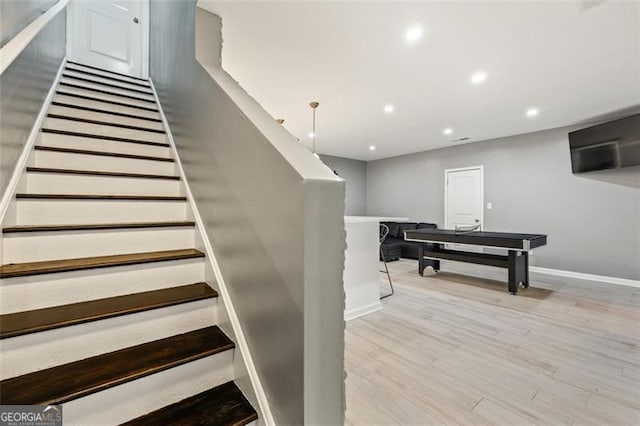 stairway featuring hardwood / wood-style flooring