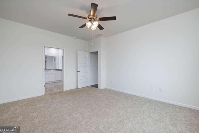 unfurnished bedroom with ceiling fan and light carpet