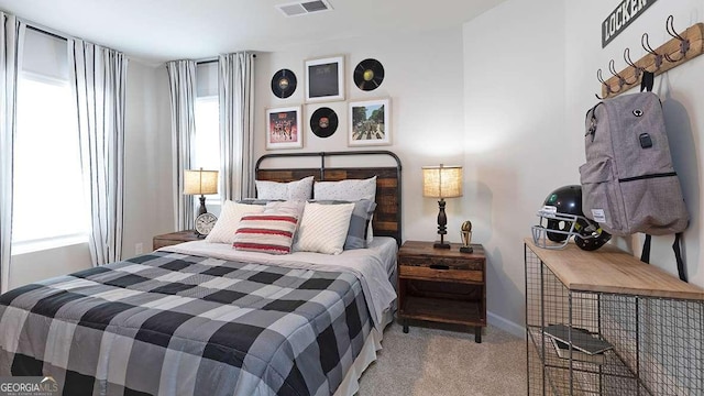 bedroom with light colored carpet