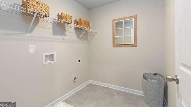 clothes washing area featuring hookup for a washing machine and electric dryer hookup