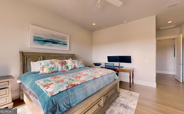 bedroom with light hardwood / wood-style floors and ceiling fan