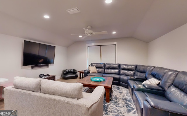 living room with ceiling fan and lofted ceiling