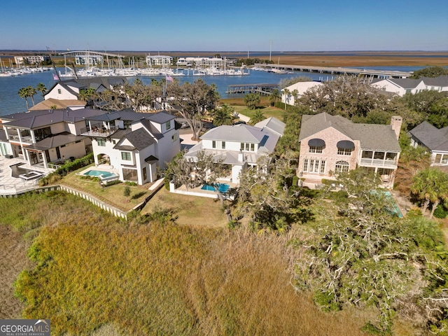 birds eye view of property featuring a water view