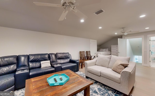 living room with ceiling fan and lofted ceiling