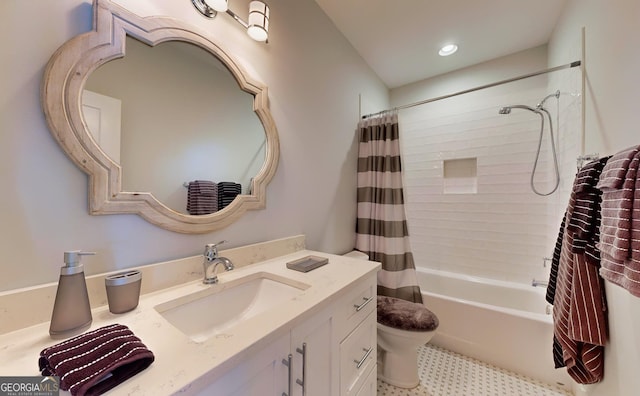 full bathroom featuring shower / bath combo, toilet, and vanity