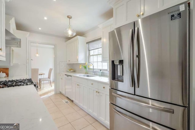 kitchen featuring sink, hanging light fixtures, stainless steel refrigerator with ice dispenser, white dishwasher, and white cabinets