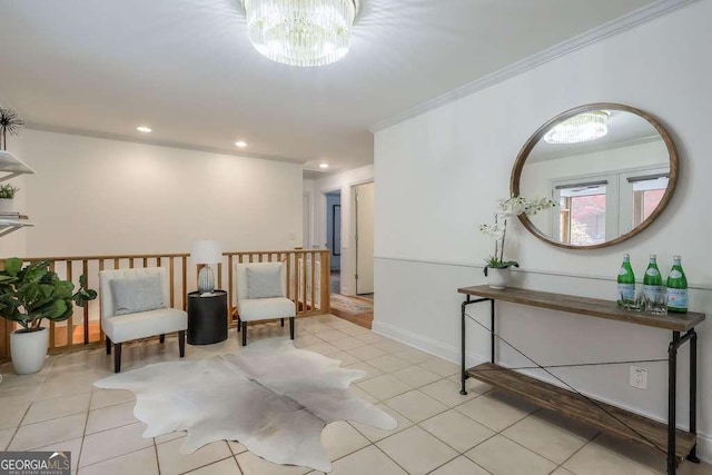 living area featuring an inviting chandelier, ornamental molding, and light tile patterned flooring