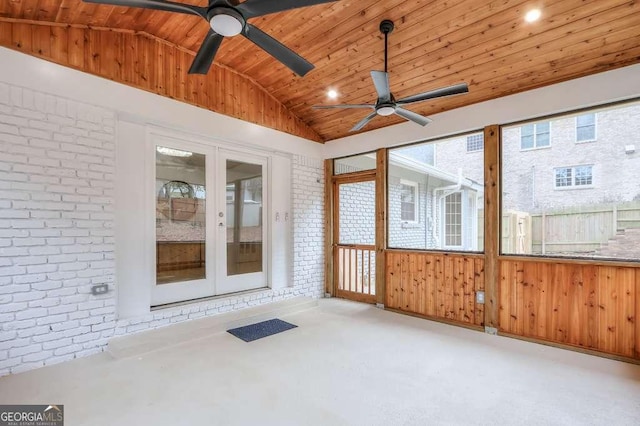 unfurnished sunroom with ceiling fan, wood ceiling, french doors, and vaulted ceiling