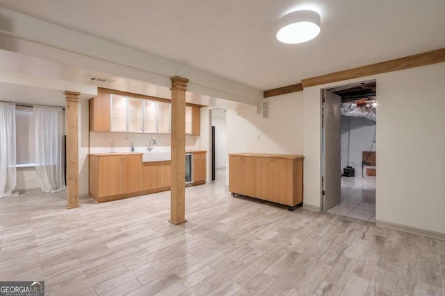 basement with light hardwood / wood-style floors