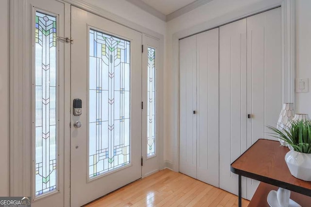 doorway to outside with light hardwood / wood-style floors and plenty of natural light