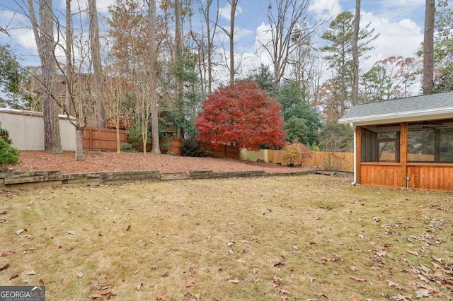 view of yard with a sunroom