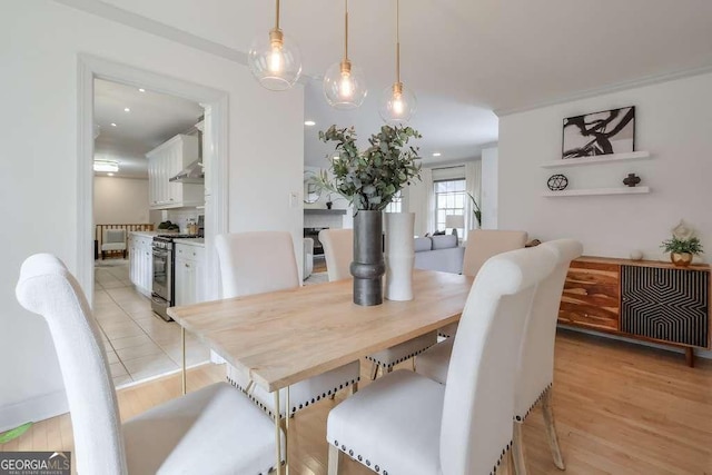 dining space with light wood-type flooring