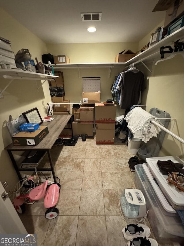 spacious closet with visible vents and light tile patterned flooring