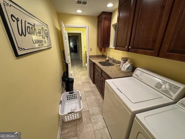 laundry room with visible vents, recessed lighting, cabinet space, a sink, and independent washer and dryer