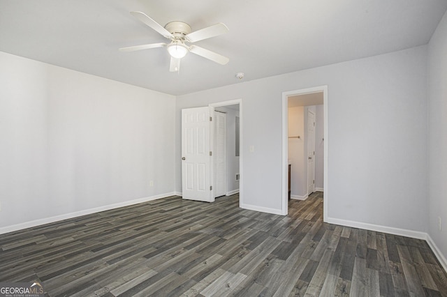 unfurnished bedroom with ceiling fan, a closet, and dark hardwood / wood-style floors