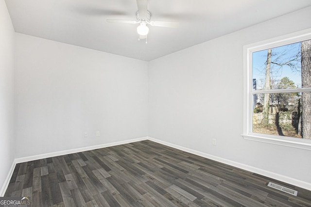 unfurnished room featuring ceiling fan and dark wood-type flooring