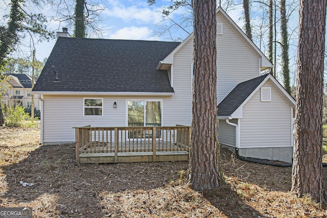 back of property featuring a wooden deck