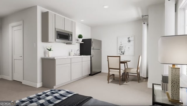 kitchen with white cabinets, sink, and stainless steel appliances